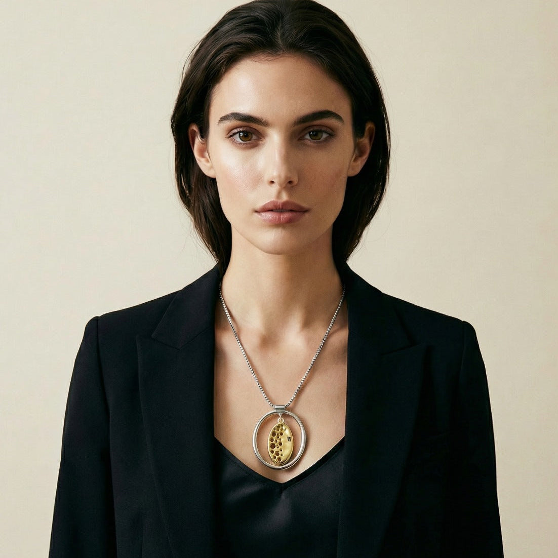 Long Cord Necklace with Rotating Emblem